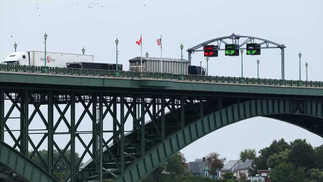 Tractor trailers cross the Peace Bridge at the Canada-United States border in Fort Erie, Ontario, Canada, on Aug. 20.