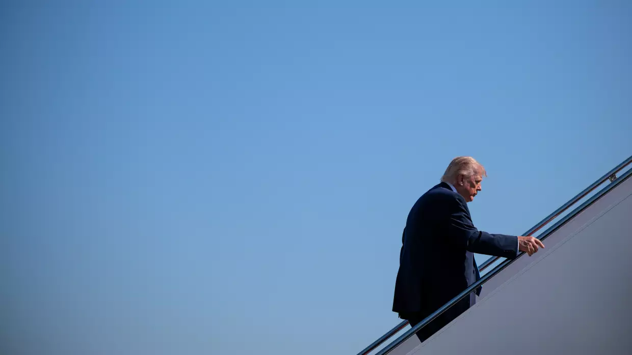 President Trump boards Air Force One after speaking to reporters on Wednesday.