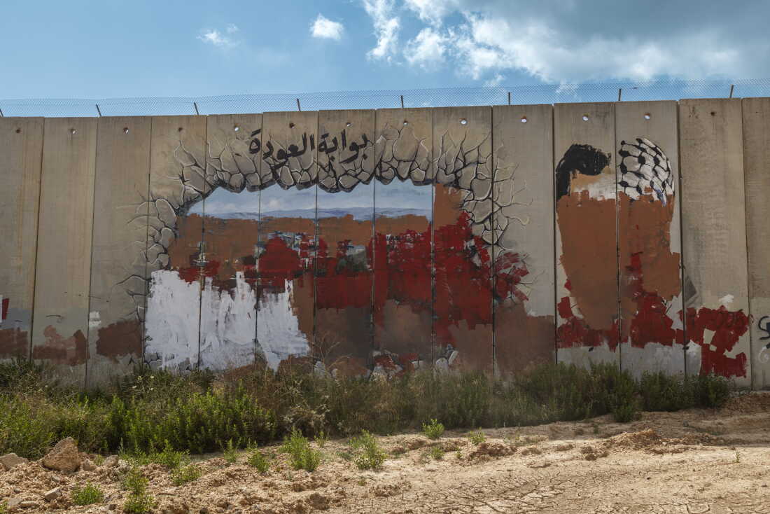 In Kfar Kila, Lebanon, a graffiti at the Fatima Gate has been crossed out. The landmark, located near the Lebanese village of Kfar Kila and Israel’s Metula, marks a former border crossing between Lebanon and Israel. Israel closed the crossing when its forces withdrew from southern Lebanon in 2000, ending an 18-year occupation.