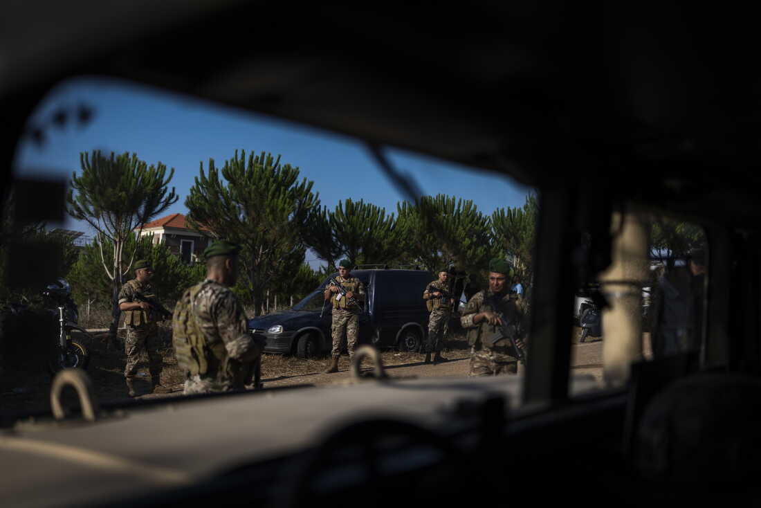On July 22, 2026, a Lebanese Army soldier at the entrance to Zawtar al-Gharbieh, southern Lebanon. Lebanese residents forced to leave their homes months ago are now slowly returning to a devastated town without electricity or running water.