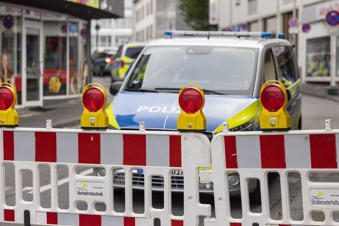 Police emergency vehicles stand at a cordon in the city center of Solingen, Germany, in the early morning of Sunday, Aug. 25, 2024, following Friday's deadly attack at the city's 650th anniversary celebrations.