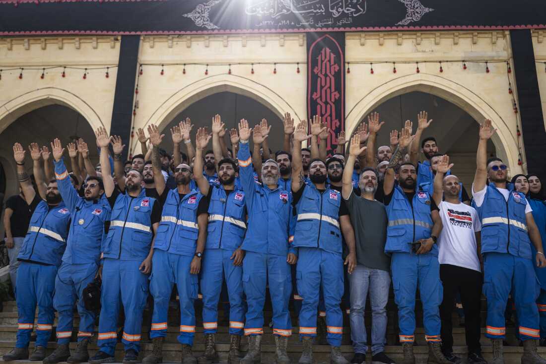 Paramedic teams mark Ashura in the mosque of a largely emptied city, surrounded by damaged buildings, in Nabatiyeh, Lebanon.
