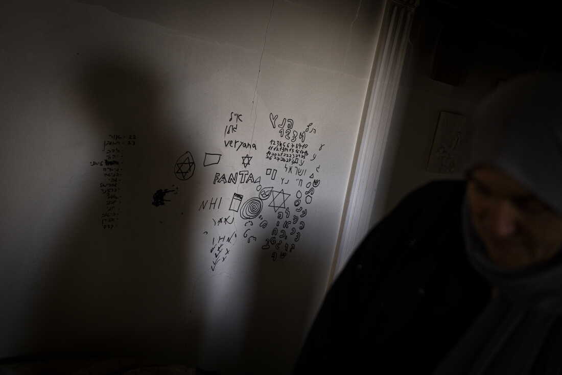 In Zawtar al-Gharbieh, drawings cover the walls of the hallway of a home occupied by Israeli soldiers, with drawings covering the walls.