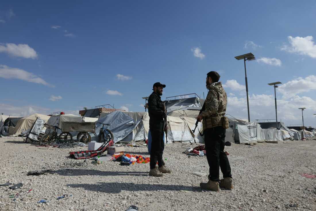 Members of the Syrian government forces stand at the empty Al-Hol camp, which was closed by the Syrian authorities on Feb. 25. Syria confirmed the mass escape of relatives of suspected Islamic State members from the Al-Hol camp last month following the withdrawal of Kurdish forces who had overseen the facility.