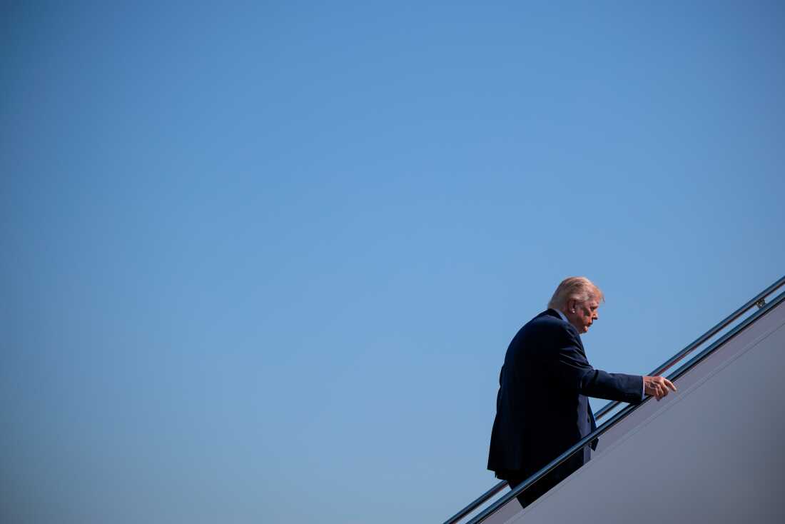 President Trump boards Air Force One after speaking to reporters on Wednesday.