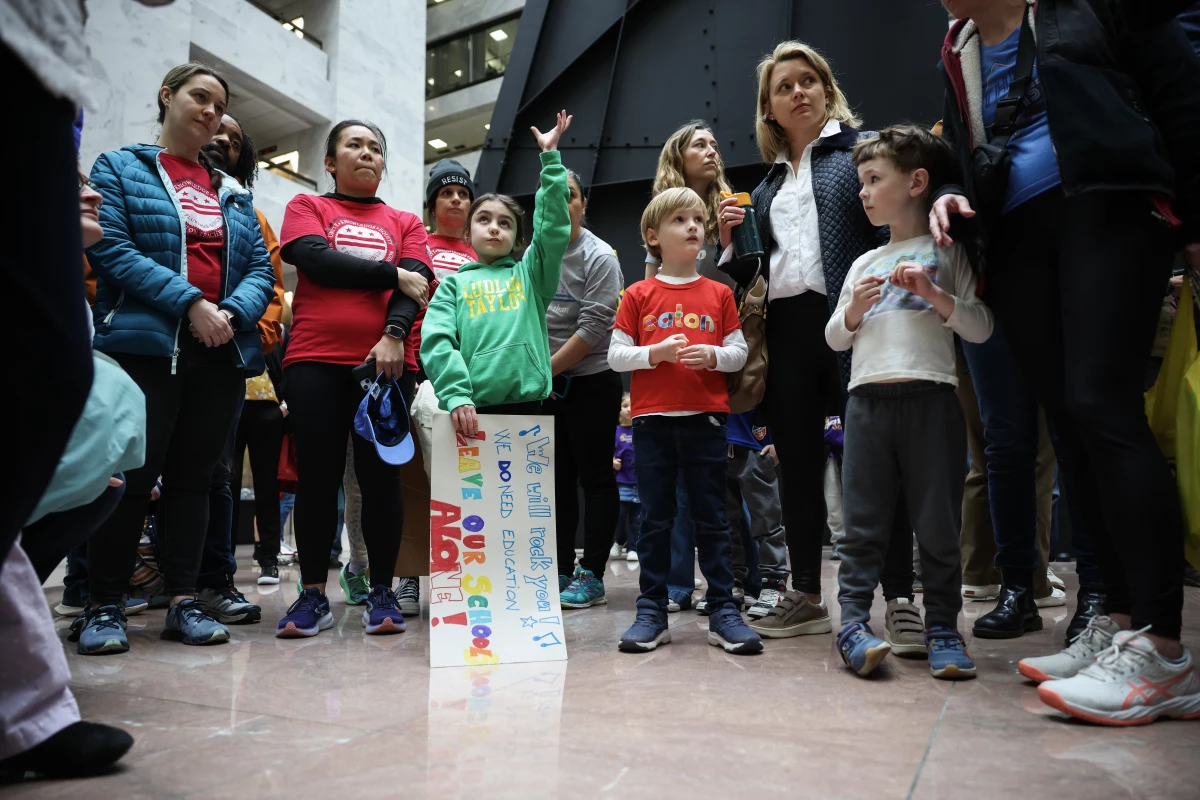 Children, parents and teachers gather on Capitol Hill in support of the U.S. Department of Education on Thursday.