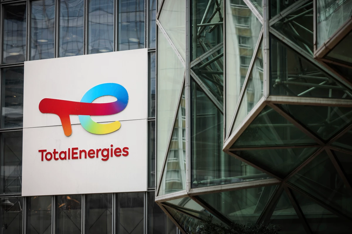 A sign for the French company TotalEnergies is displayed at headquarters March 21, 2025, in La Defense business district outside of Paris.