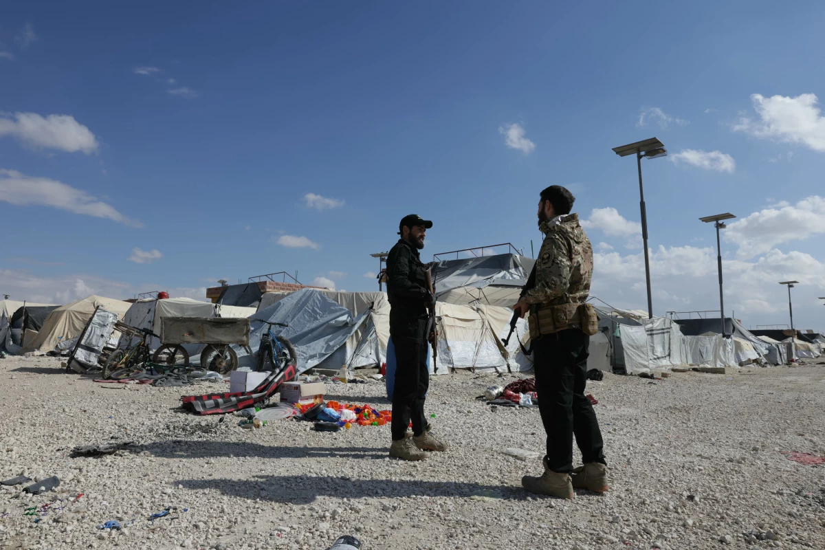 Members of the Syrian government forces stand at the empty Al-Hol camp, which was closed by the Syrian authorities on Feb. 25. Syria confirmed the mass escape of relatives of suspected Islamic State members from the Al-Hol camp last month following the withdrawal of Kurdish forces who had overseen the facility.