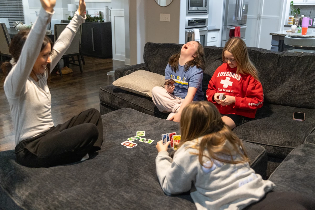 Brooklynn, center, loves playing Uno with her mom and sisters.