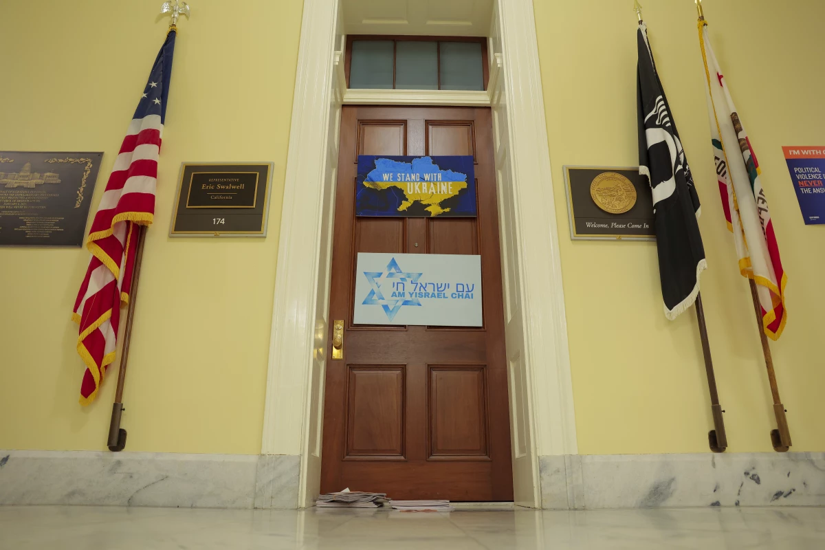 A name plate hangs outside the office of Rep. Eric Swalwell, D-Calif., in Cannon House Office Building on April 14. Swalwell announced Monday that he would resign amid allegations of sexual misconduct brought against him.