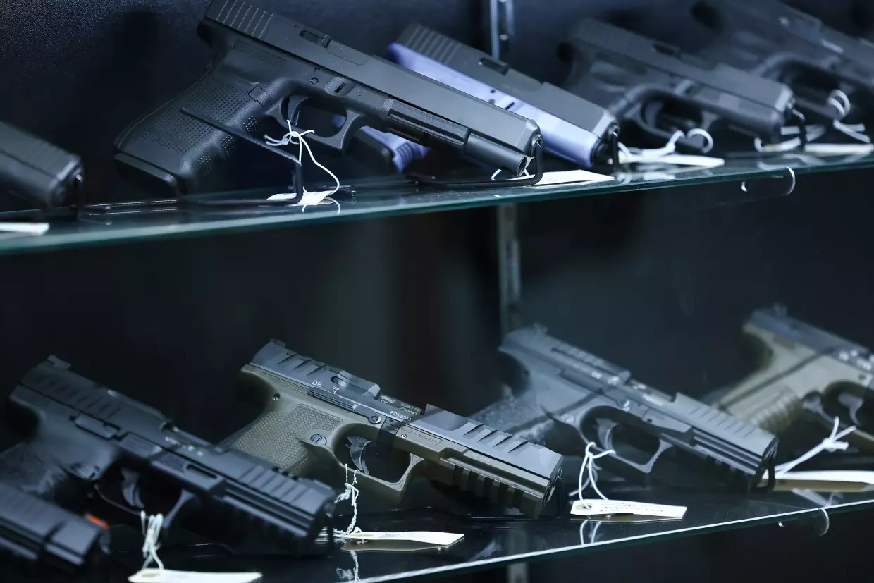 Glock and Walther Arms semi-automatic pistols are displayed for sale in a gun store in Arizona on Sept. 17, 2025.