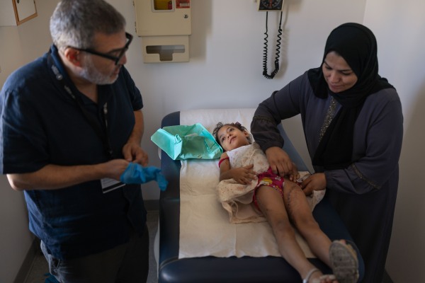 Beirut, Lebanon. August 20, 2025. Dr. Ghassan Abu Sittah, a British-Palestinian war surgeon who worked in Gaza hospitals during the early months of Israel’s war, examines a young Gazan patient at the American University of Beirut Medical Center. The Ghassan Abu Sittah Children’s Fund transports critically injured children and their caretakers from Palestine to Lebanon for treatment and support before they return home. UNICEF says more than 50,000 children have been killed or injured in the Gaza Strip. Diego Ibarra Sánchez for NPR