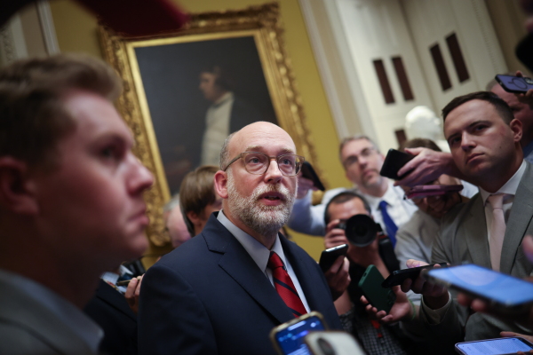 Russell Vought, the director of the Office of Management and Budget, speaks with reporters at the U.S. Capitol on July 15th. OMB said this week it was "making every preparation to batten down the hatches and ride out the Democrats’ intransigence.”