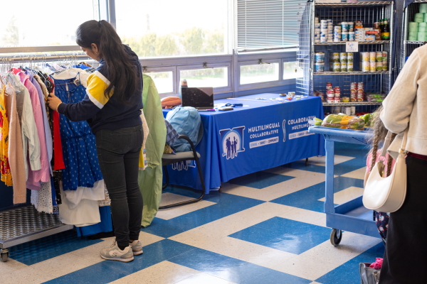 Families sort through donated clothing, jewelry and shoes at the Island Oasis.