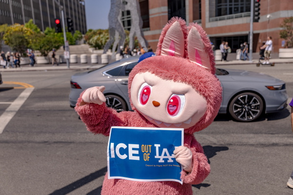 A protester wearing Labubu costume holds a placard calling on ICE to leave LA as protesters continue anti-ICE demonstrations on the second day in Los Angeles on June 7.