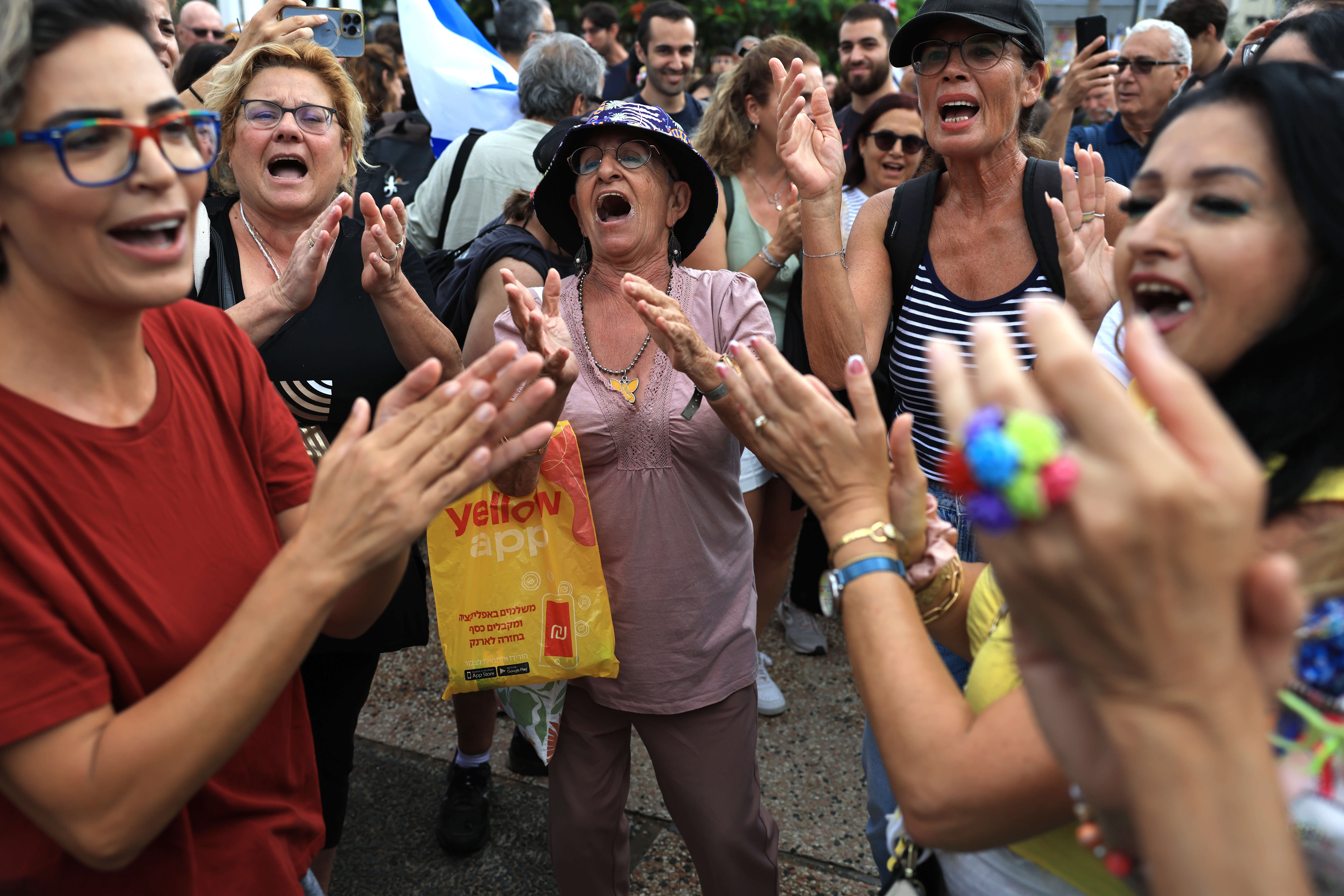Israelis celebrate as they react to the news of the Gaza peace deal at Hostages Square on Thursday in Tel Aviv, Israel. (Getty Images)