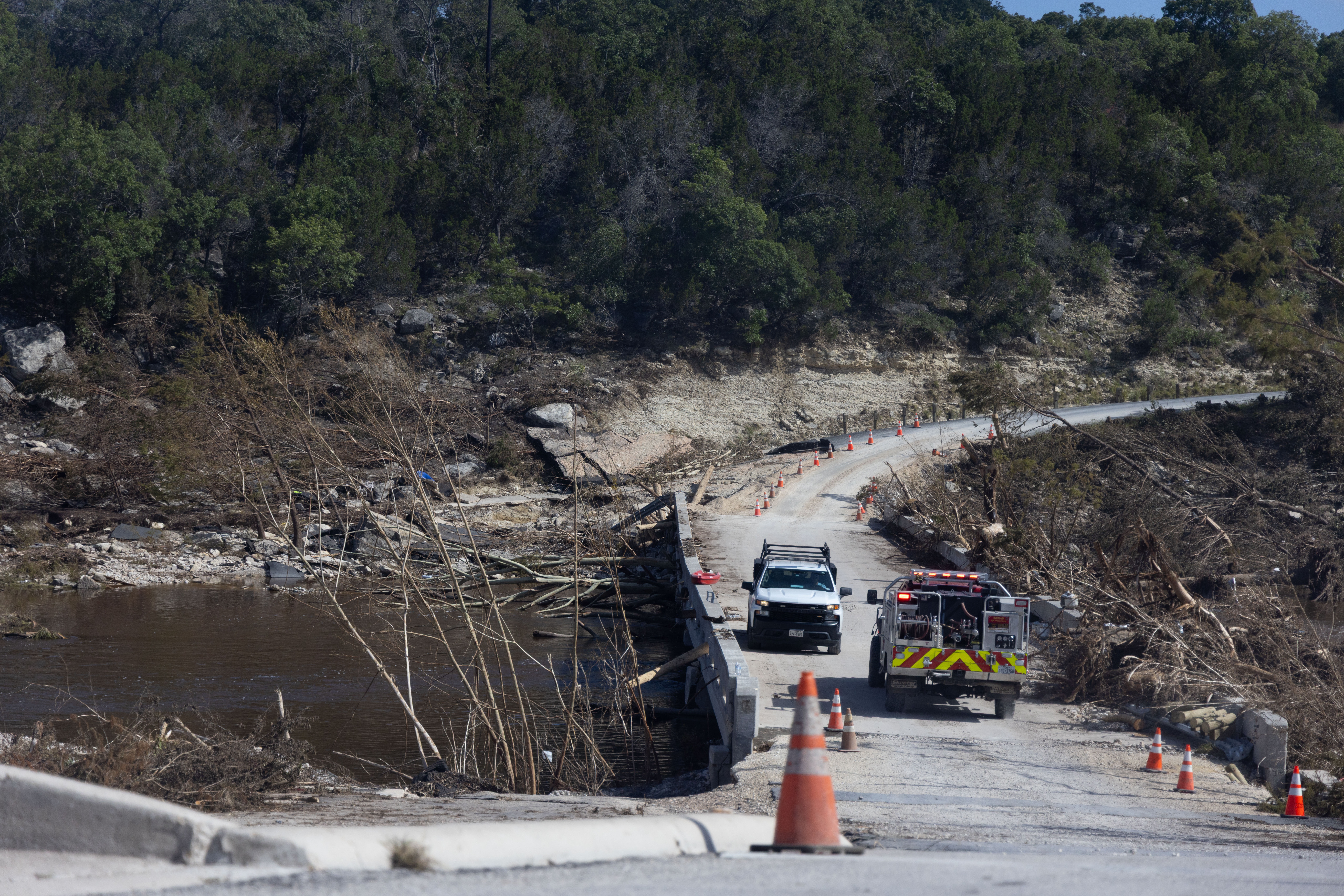 Flood damage is seen out of the car window along the route that Coach Tate DeMasco, athletic director and head football coach for Ingram Tom Moore High School in Ingram, Texas, takes to deliver hot meals and cold drinks to neighborhoods and relief workers along the Guadalupe River, who were heavily impacted by the Fourth of July flooding. The meals are provided by Mercy Chefs, a disaster and humanitarian relief organization.