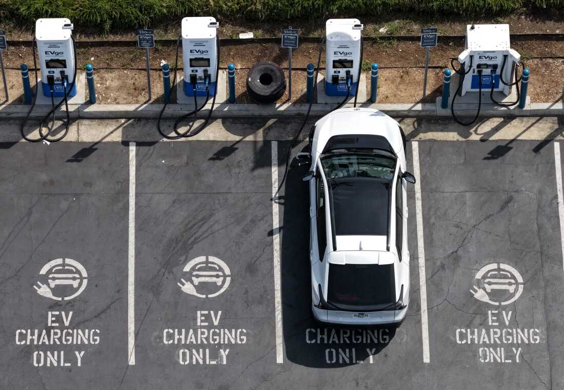 An electric vehicle charges at an EVgo electric charger in Monrovia, Calif.