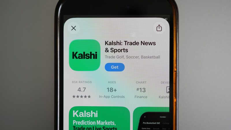 FILE - An ad for the prediction market app Kalshi is displayed on a mobile phone on April 16, 2026, in Chicago. (AP Photo/Erin Hooley, File)