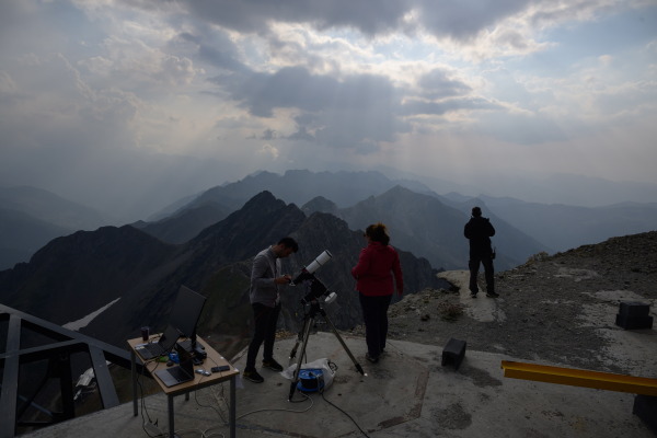 Staff from the University of Toulouse prepare equipment ahead of observing a partial solar eclipse on the summit of the Pic du Midi, France.
