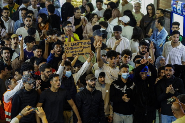 Protesters shout slogans during a youth-led demonstration in a market area in Rabat on September 29, 2025, calling for reforms in the public health and education sectors.