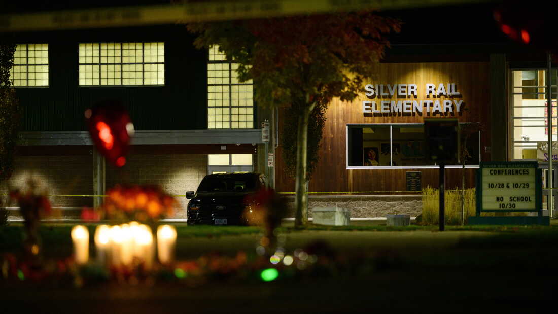 A candlelight memorial is seen out front of Silver Rail Elementary School in Bend, Oregon.