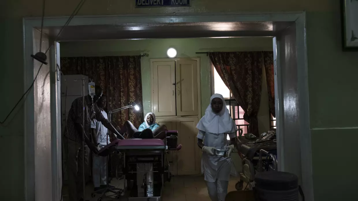 A senior midwife sutures a woman who has just given birth in Borno State, Nigeria. Around the world, postpartum bleeding is a serious issue, leading to 43,000 deaths a year. A new series of reports proposes ways to prevent and to treat it.