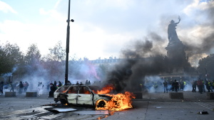 A car burns at Place de La Republique during a protest against rising living costs in Paris, on Saturday.