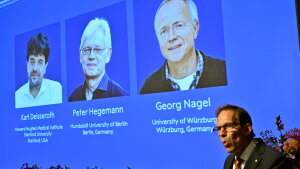 Karl Deisseroth, Peter Hegemann and Georg Nagel are shown on the screen as they are awarded the 2026 Nobel Prize in Physiology or Medicine, as announced during a press conference at the Nobel Forum at Karolinska Institutet in Stockholm, Sweden, Oct. 5, 2026.