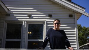 Tulsa, OK - OCT 17: Natalie Donaldson, an Army veteran, poses for a portrait at her home on October 17, 2024, in Tulsa, OK. Donaldson is currently dealing with Veteran Affairs forbearance policy changes that resulted in her monthly payments jumping 50%. (Michael Noble, Jr. for NPR)