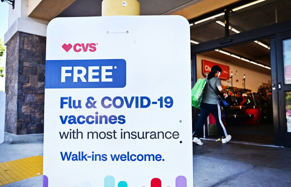 A person enters a CVS store in Monterey Park, California, where flu and COVID-19 vaccines are offered.