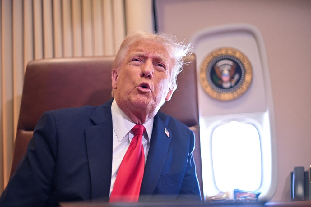 President Trump speaks to the press aboard Air Force One on Sunday. (AFP via Getty Images)