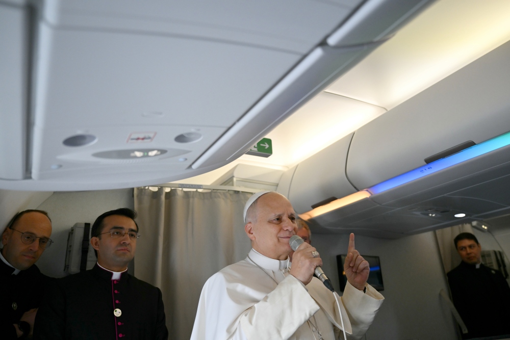 Pope Leo XIV speaks to journalists aboard his flight bound for Algiers' Houari Boumédiène International Airport on Monday, April 13, 2026, at the start of an 11-day apostolic journey to Africa. (AP)