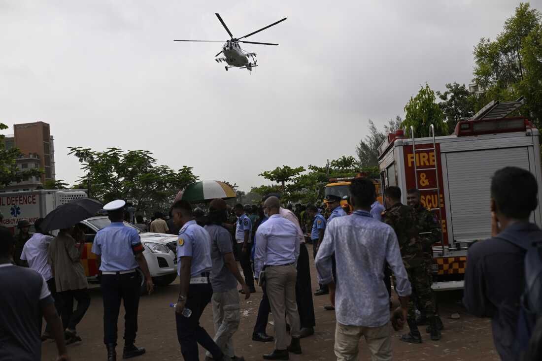 A helicopter carrying injured victims of a Bangladesh Air Force training aircraft crash in Dhaka, Bangladesh, Monday.