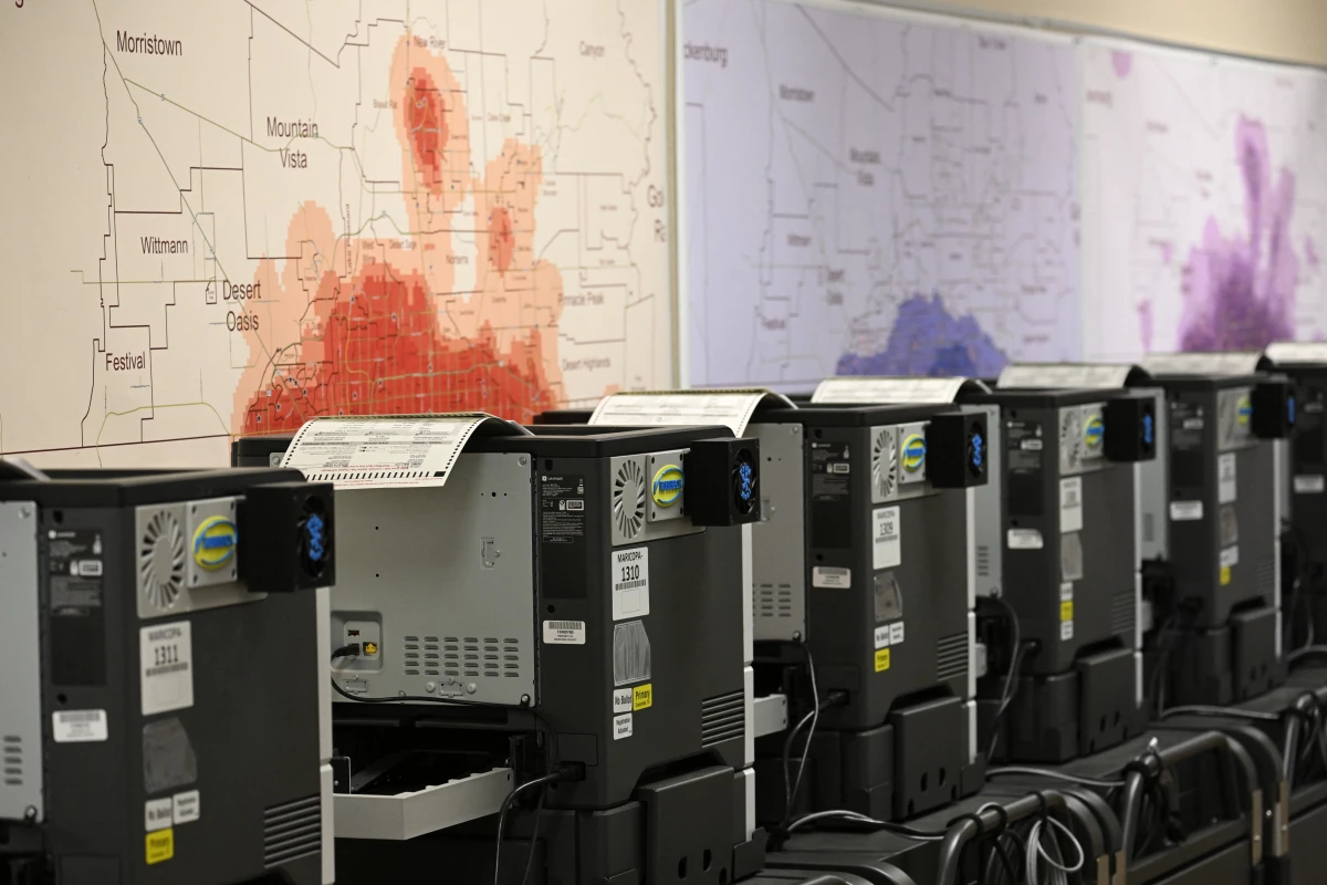 Ballot printers for in-person voting are loaded with test ballots in a storage warehouse at the Maricopa County Tabulation and Election Center in Phoenix on June 3.