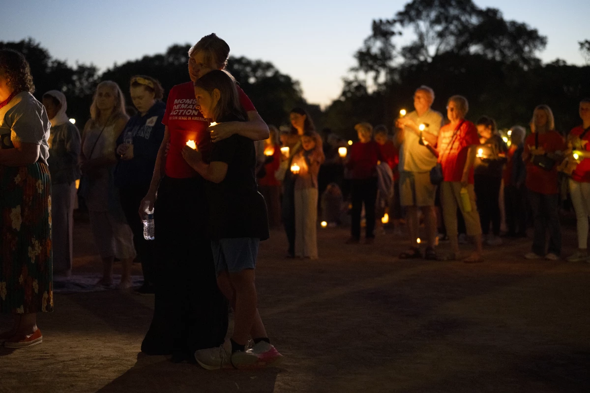 People attend a vigil following a mass shooting at Annunciation Catholic School on August 27, 2025 in Minneapolis, Minnesota.