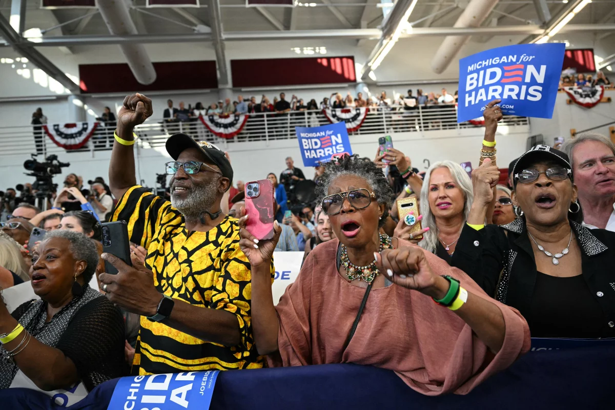 Supporters cheer as President Biden arrives at Renaissance High School in Detroit on July 12.