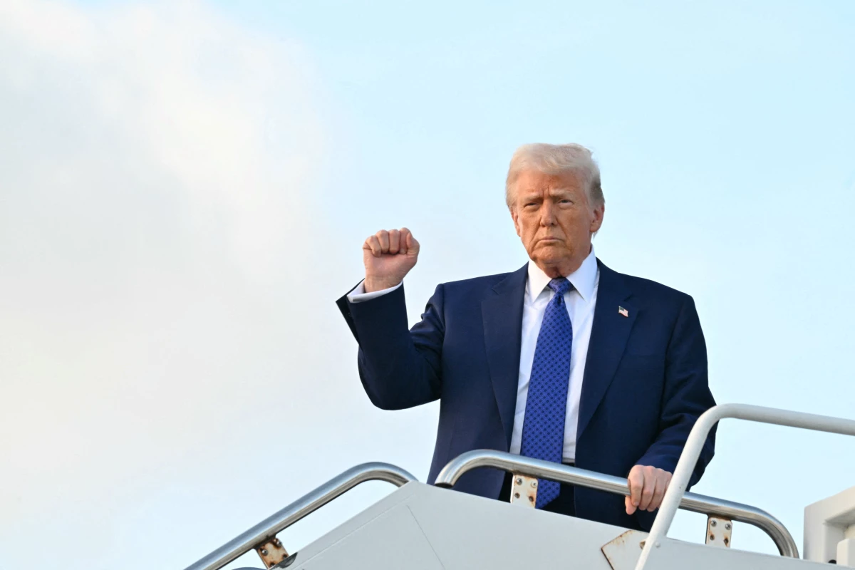 President Trump steps off of Air Force One at Palm Beach International Airport in West Palm Beach, Fla., on Feb. 14, 2025.