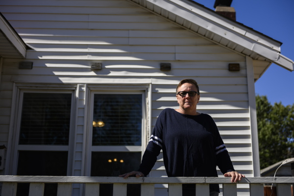 Tulsa, OK - OCT 17: Natalie Donaldson, an Army veteran, poses for a portrait at her home on October 17, 2024, in Tulsa, OK. Donaldson is currently dealing with Veteran Affairs forbearance policy changes that resulted in her monthly payments jumping 50%. (Michael Noble, Jr. for NPR)