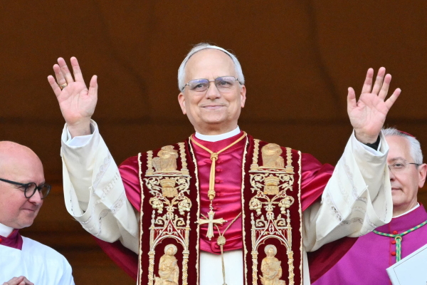 Pope Leo XIV arrives on the balcony of St. Peter's Basilica for the first time since he was elected pope.