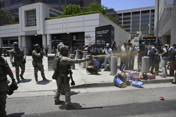 ICE officers and national guards confront with protesters outside of the Metropolitan Detention Center in Los Angeles, California on June 8, 2025 amid protests over immigration raids.