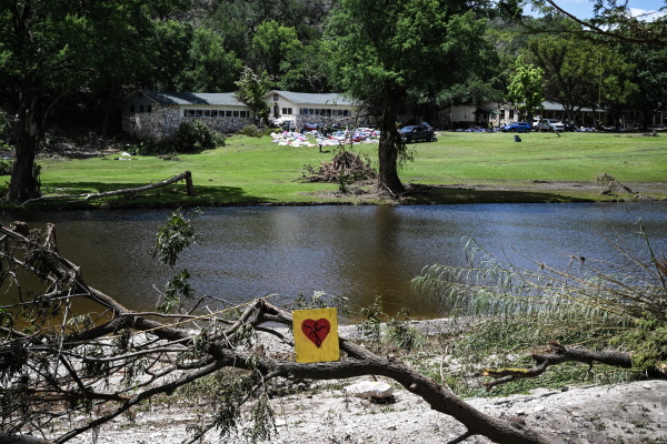 A painted broken heart is seen near Camp Mystic along the Guadalupe River in Hunt, Texas, on July 8, 2025, after severe flash flooding over the July 4 holiday weekend.