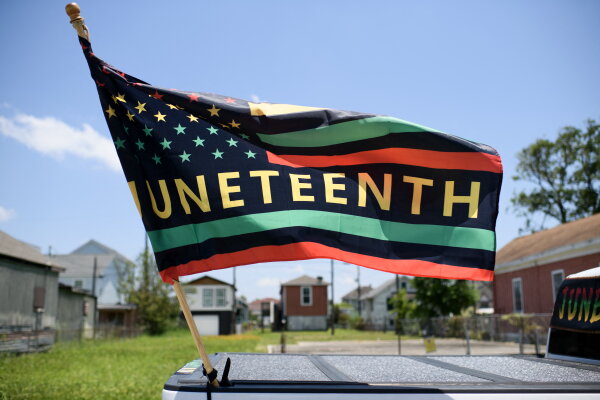 Juneteenth Stories: Meaning & Reflections | NPR Juneteenth flag on a float