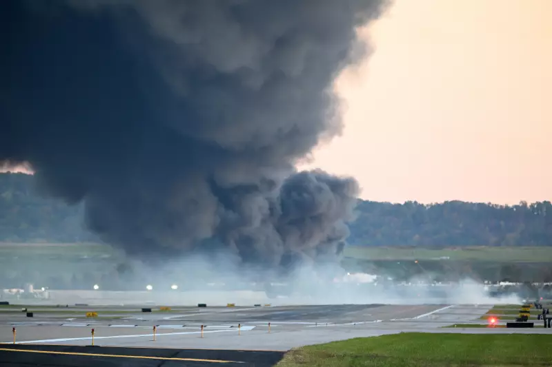 Fire and smoke mark where a UPS cargo plane crashed near Louisville Muhammad Ali International Airport on November 04, 2025 in Louisville, Kentucky.