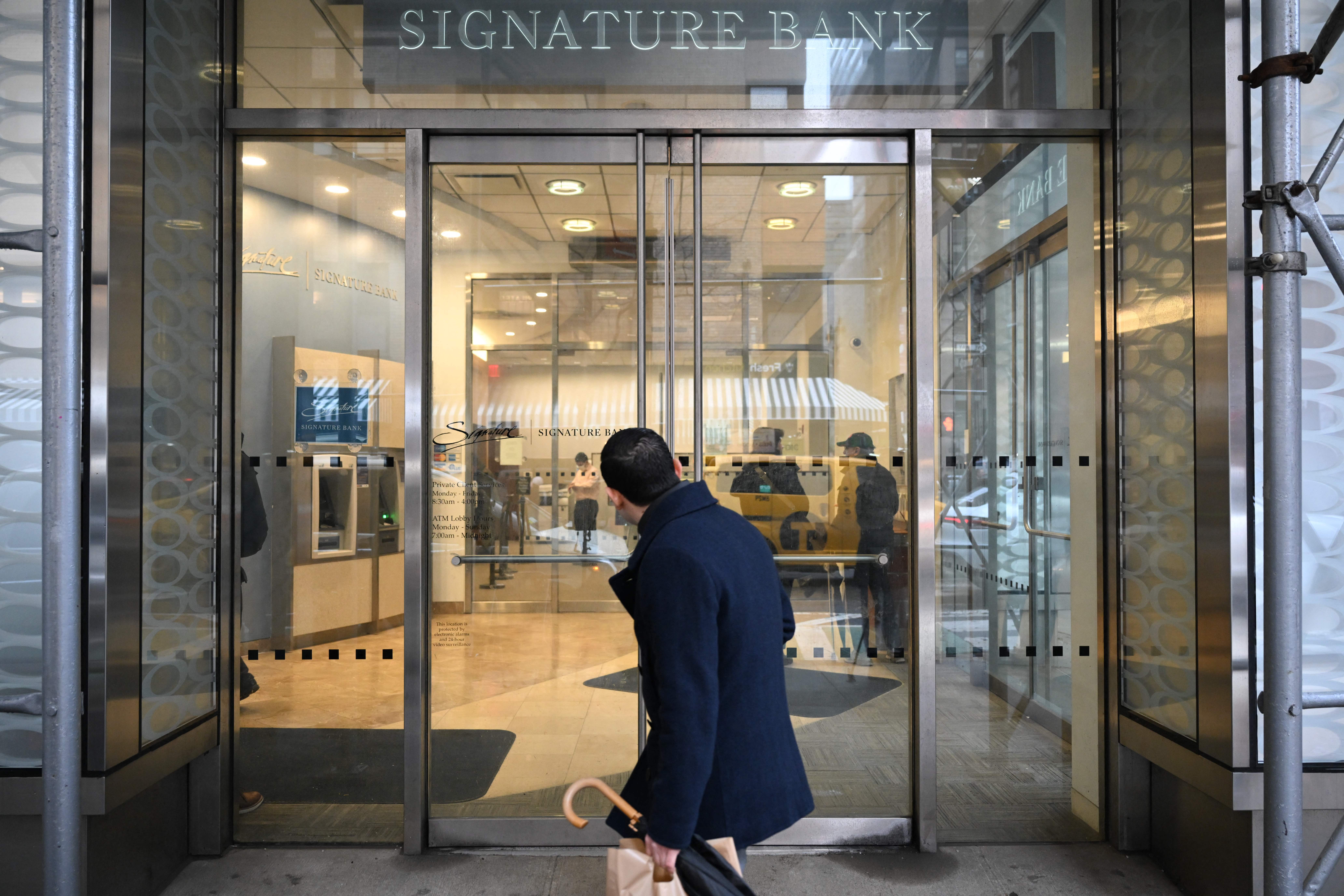 A man walks past a branch of Signature Bank in New York City on March 13, 2023. After Signature Bank collapsed during the 2023 regional banking crisis, the Federal Deposit Insurance Corp. said it didn