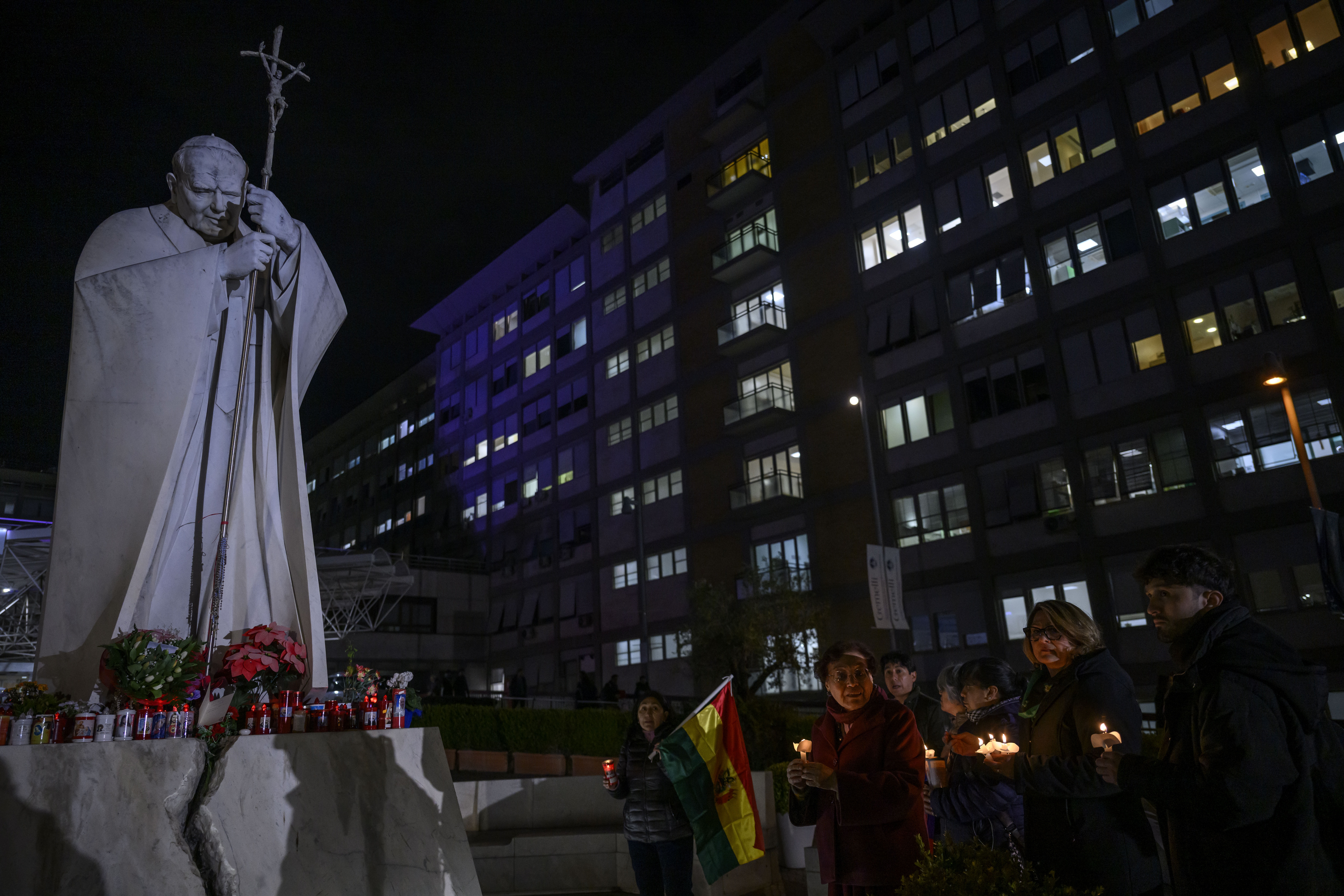 Faithful pray for Pope Francis outside the Policlinico A. Gemelli Hospital in Rome, where Pope Francis is hospitalized.