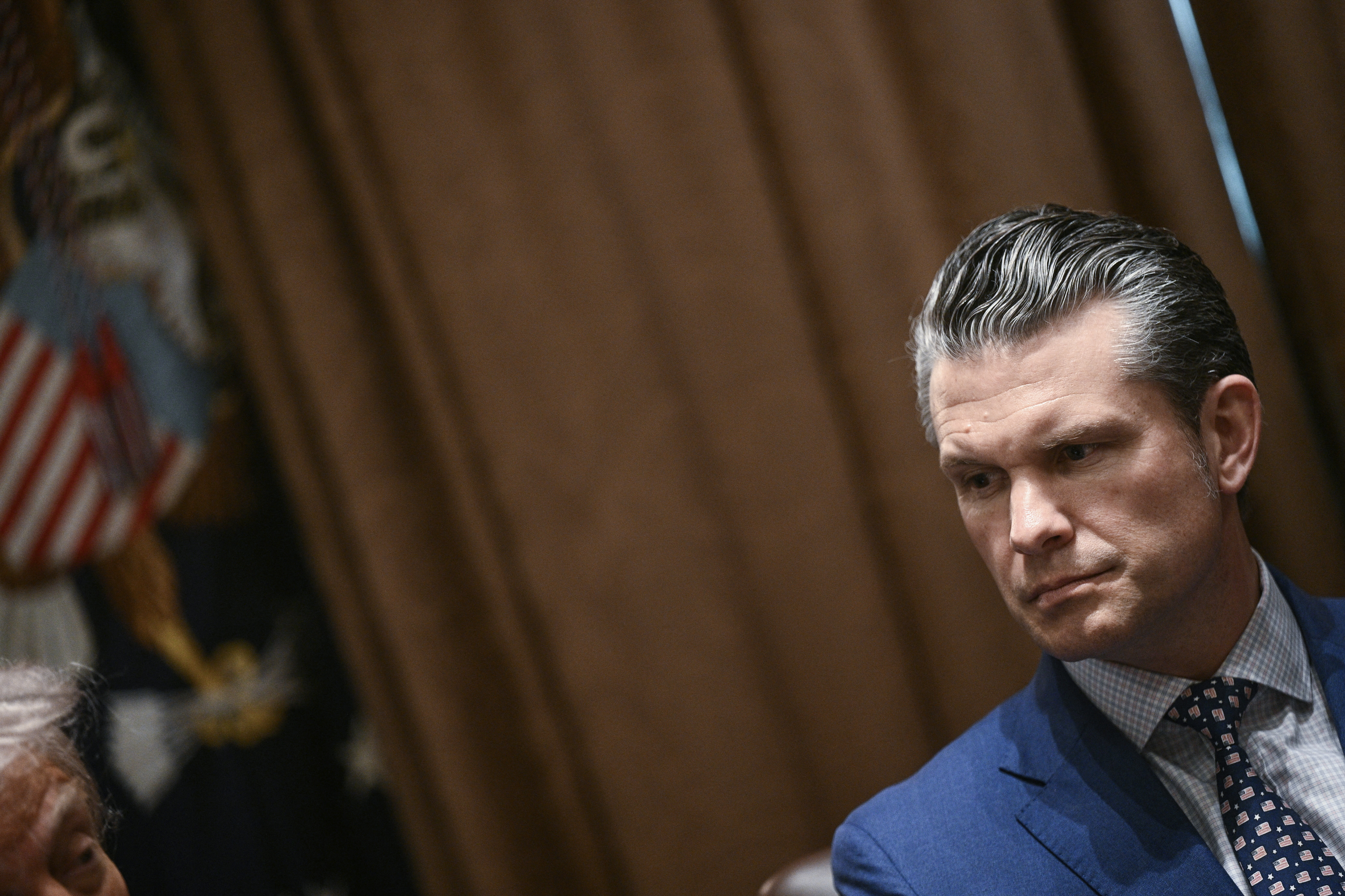 Secretary of Defense Pete Hegseth looks on during a cabinet meeting with President Trump in the Cabinet Room of the White House on April 10.