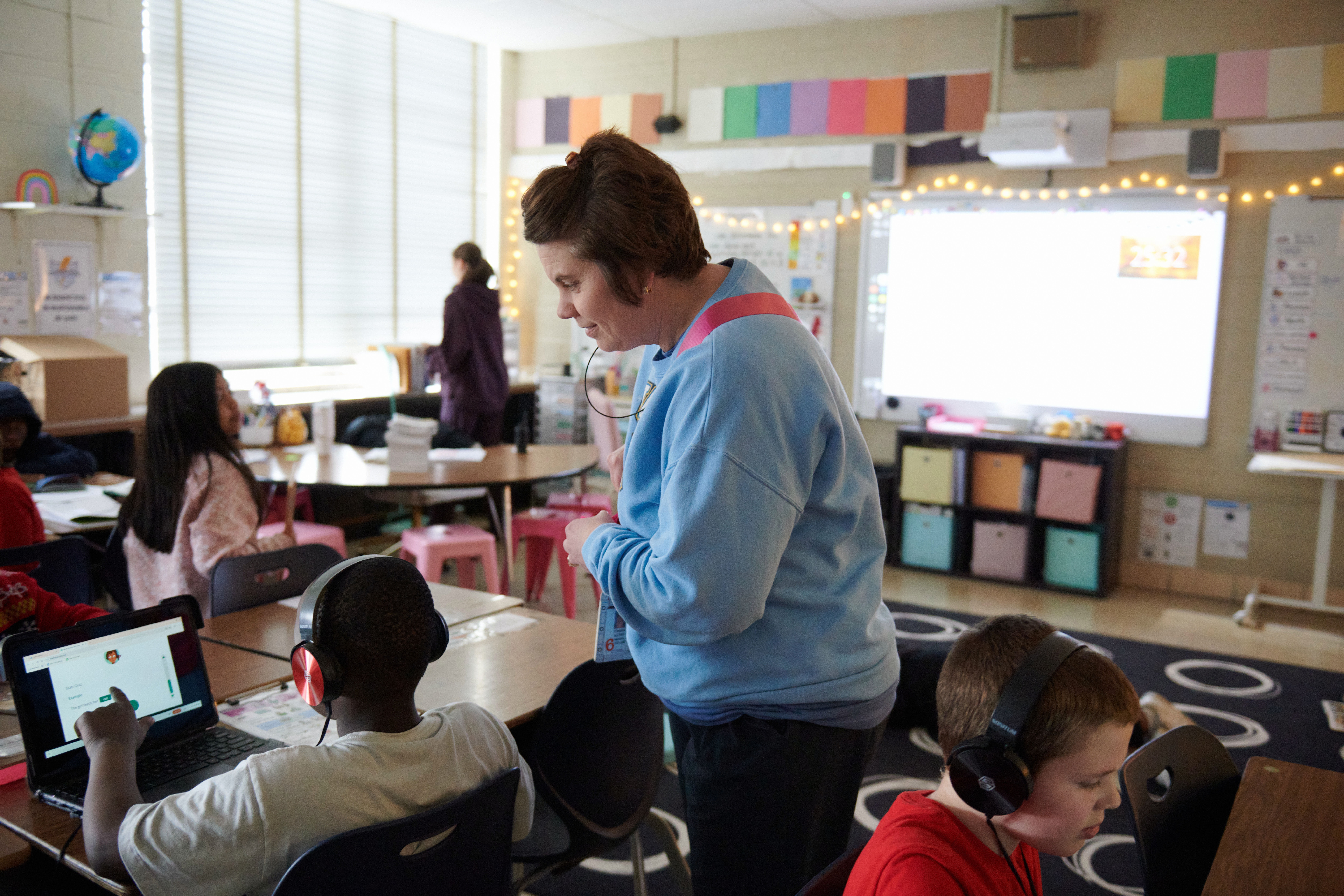 Principal Condra Allred visits a third grade class at Cleveland Elementary School in Cedar Rapids, Iowa, in April. Soon, Allred expects to hear for certain if her school will close.