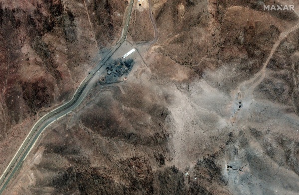 A satellite image of Iran's Fordo nuclear site shows clusters of new holes likely caused by U.S. bunker buster bombs dropped over the weekend following orders by President Trump.