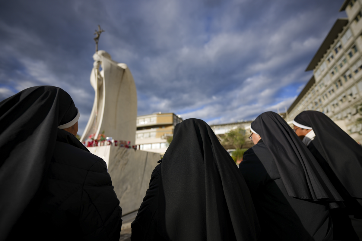 Nuns pray for Pope Francis in front of the Agostino Gemelli Polyclinic, in Rome, Thursday, Feb. 27, 2025, where Pope Francis is hospitalized since Friday, Feb. 14.